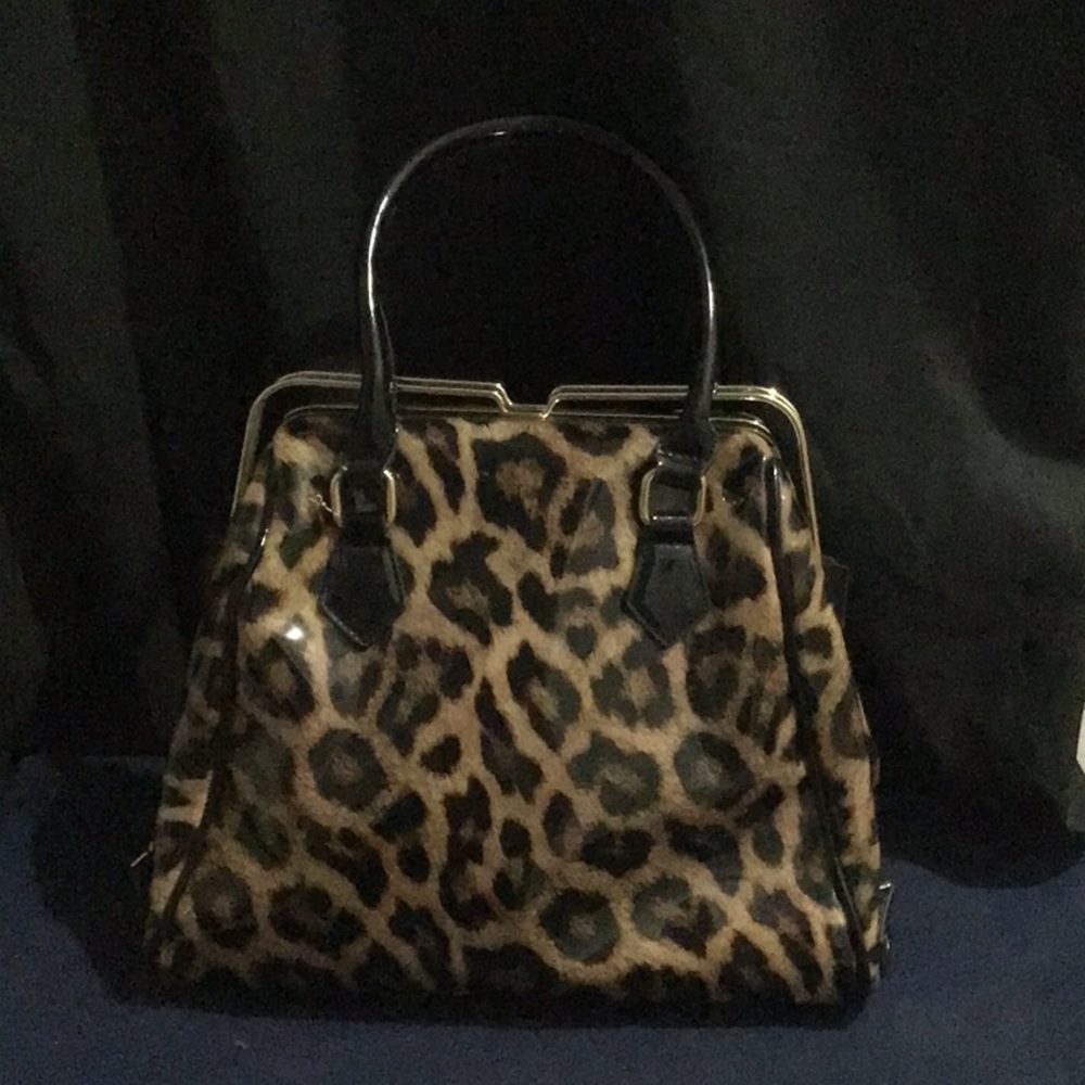 Elegant leopard A frame purse w/ long extra strap for wear as shoulder bag.